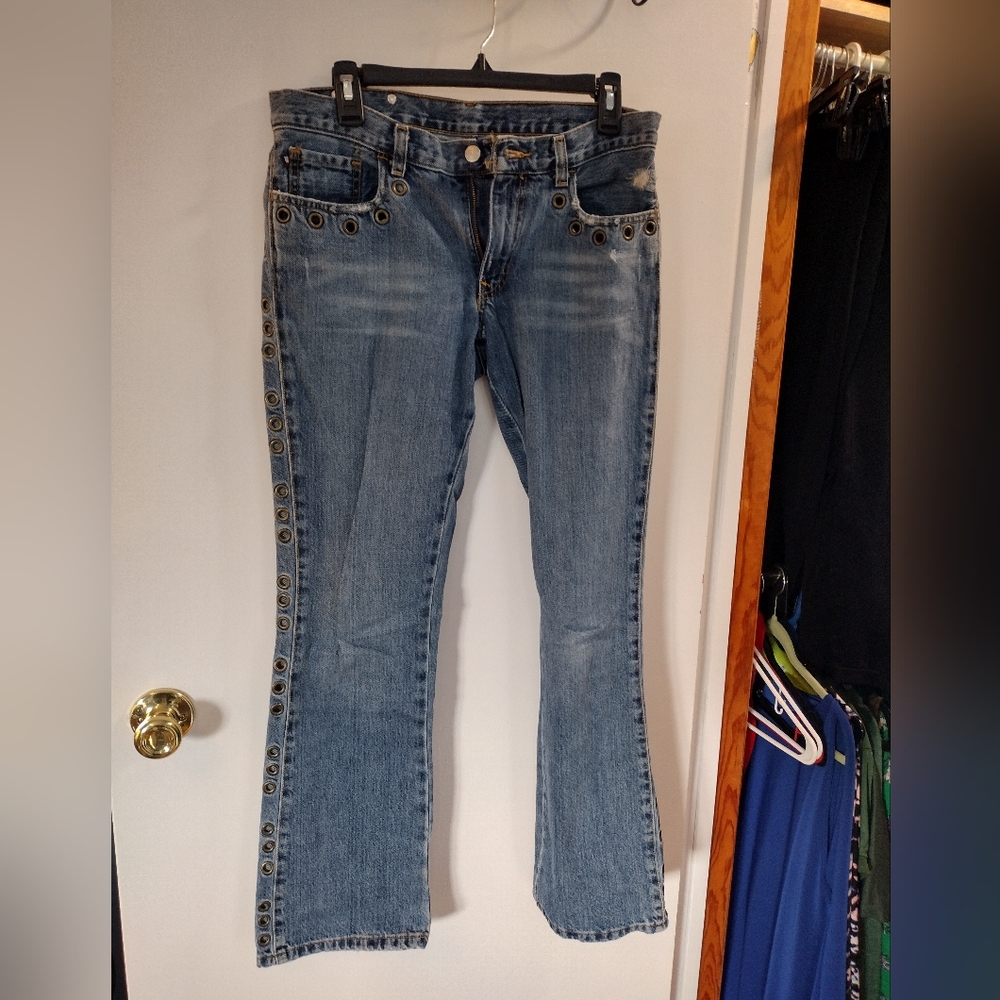 Ralph Lauren jeans. Size 6. Boot cut. Gold ring cut outs on both sides.